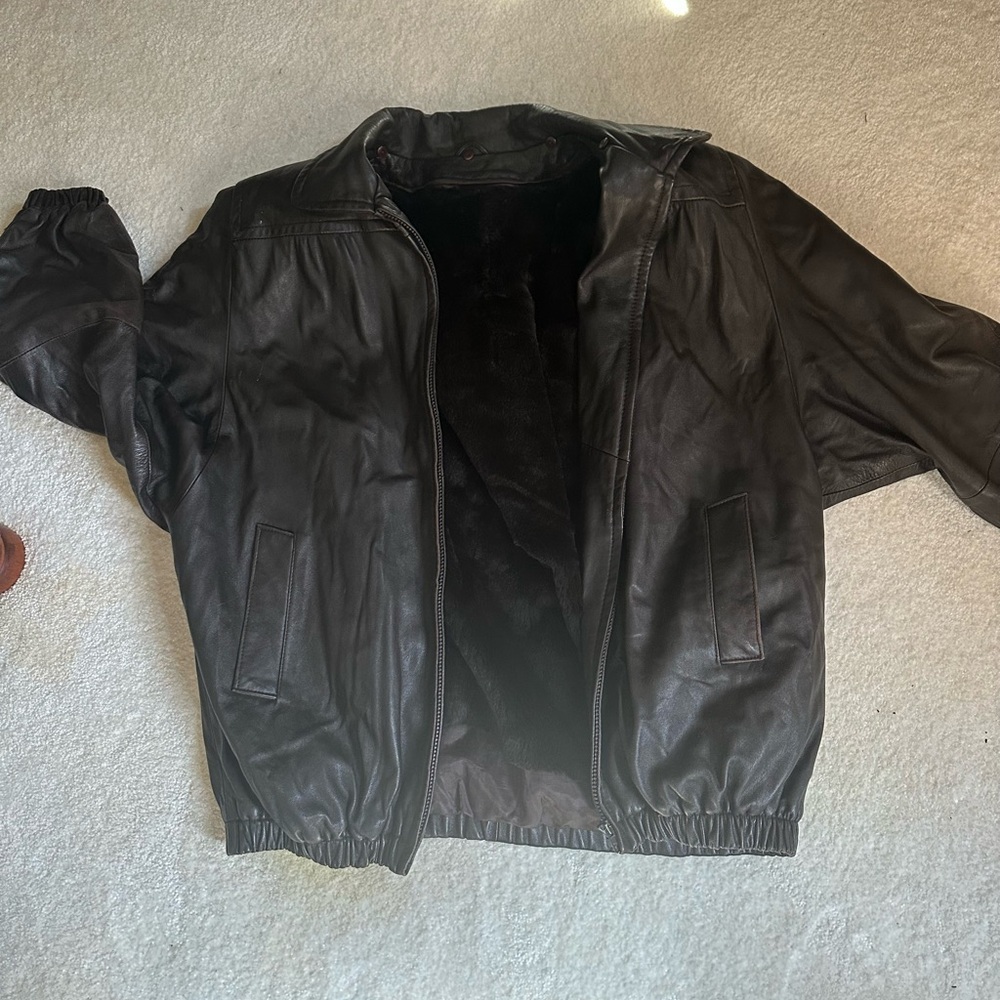 Black leather jacket with removable real fur lining.